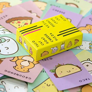 Taco Cat Goat Cheese Pizza card game box and cards laid out on a surface
