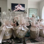 Beautifully wrapped gift basket with straw basket and cellophane wrap, ready to be gifted.
