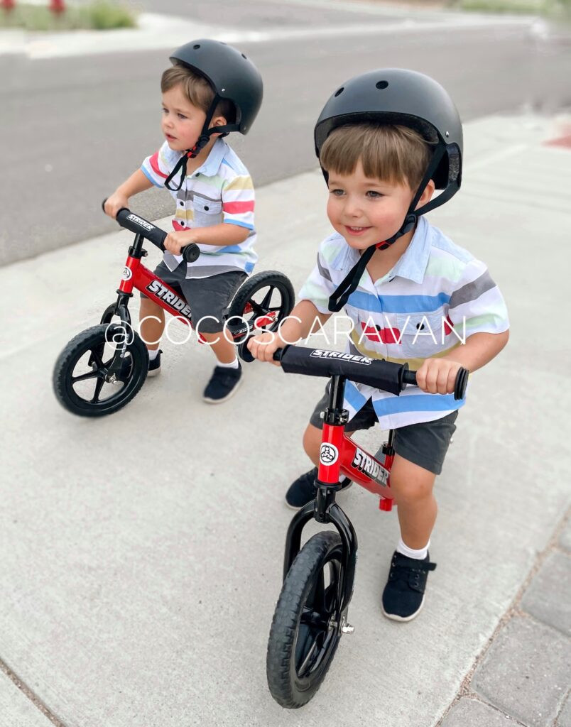 Toddler riding a balance bike outdoors