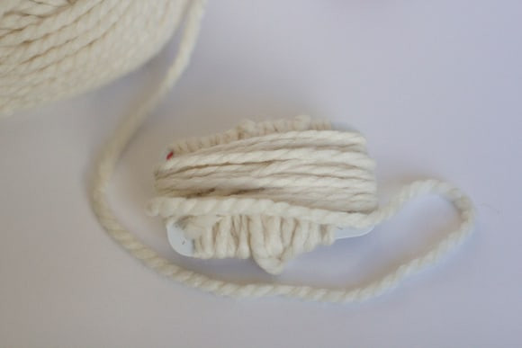wrapping a gift card with yarn