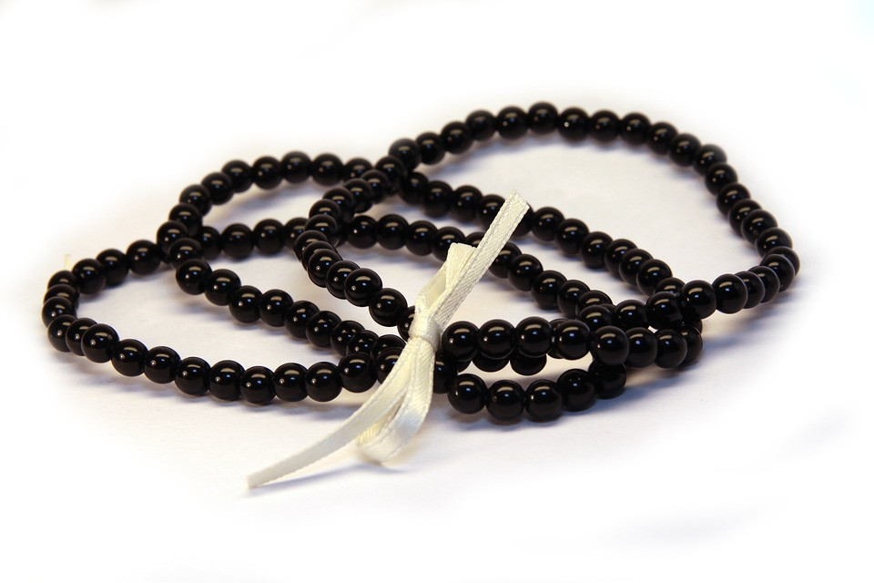 A set of black beaded bracelets