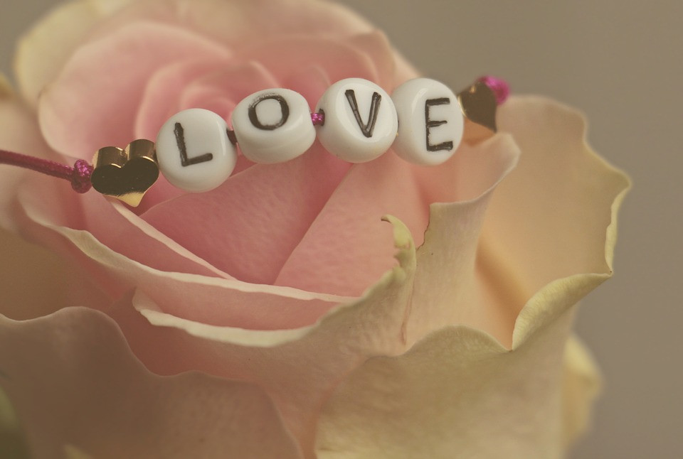 A bracelet with letter beads that spell 