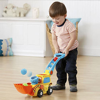 VTech Pop-a-Balls Push &amp; Pop Bulldozer, a yellow bulldozer toy that pops balls out of the chimney