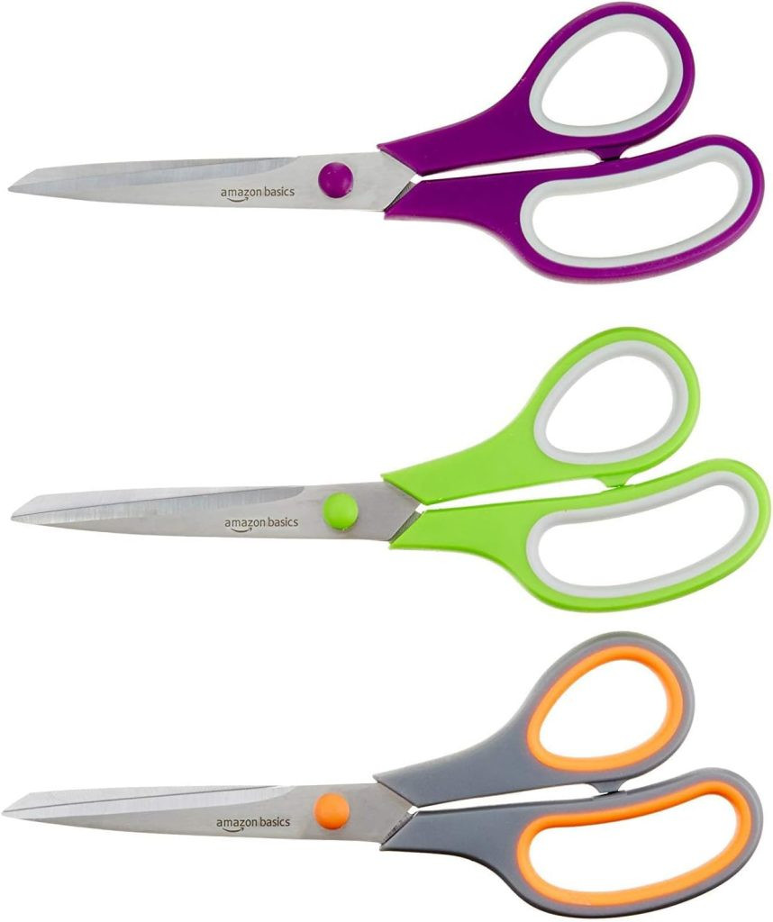 Three pairs of scissors with colored handles - purple, green, and gray with orange - perfect for gift wrapping projects. Each is labeled , presenting a multi-pack of essential scissors for gift packaging tasks.