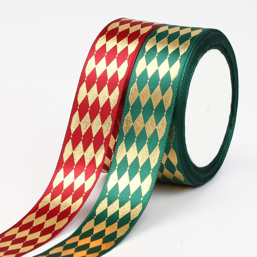 Two rolls of ribbon, perfect for gift wrapping, one red and gold, the other green and gold, featuring a diamond pattern, are displayed side by side against a white background, presenting patterned ribbon choices for festive gift packaging.