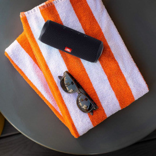 JBL Flip 5 portable waterproof Bluetooth speaker in a vibrant color.