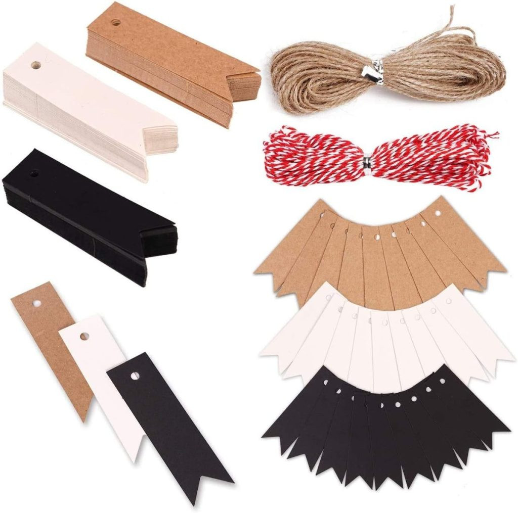 Craft materials for gift wrapping include rectangular tags in brown, white, and black with hole punches. The set also features a bundle of twine and red-and-white string to add a personal touch to your presents, displaying kraft gift tags and twine for rustic gift packaging.