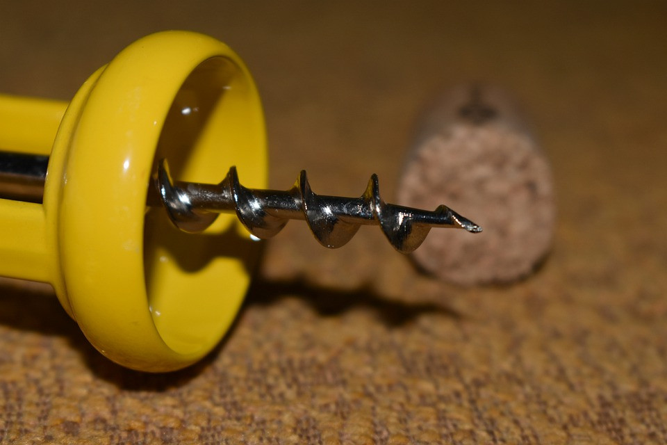 A close-up of a corkscrew wine opener