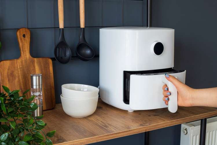 Air fryer, a practical random birthday gift idea for wife, enhancing culinary adventures and healthy cooking options (via Canva)