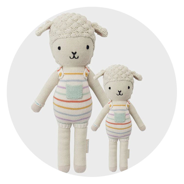 Avery the Lamb from cuddle + kind, a religiously symbolic and charitable baptism gift, with a larger version for godparents and smaller for godchild.