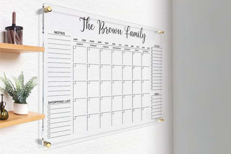 Customized family calendar, a practical random birthday gift idea for wife, organizing family schedules and displaying cherished photos (via Etsy)