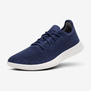 Alt text: Allbird's Tree Runner Sneakers in hazy indigo color, highlighting their lightweight and breathable design.