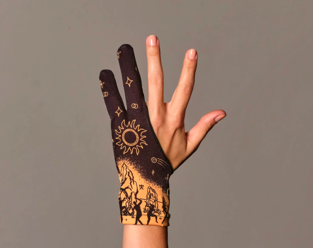 Artist using a drawing glove on a digital tablet