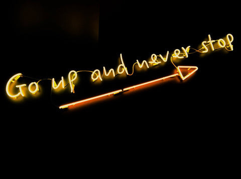 Neon arrow sign glowing brightly, a cool and trendy decorative lighting gift.