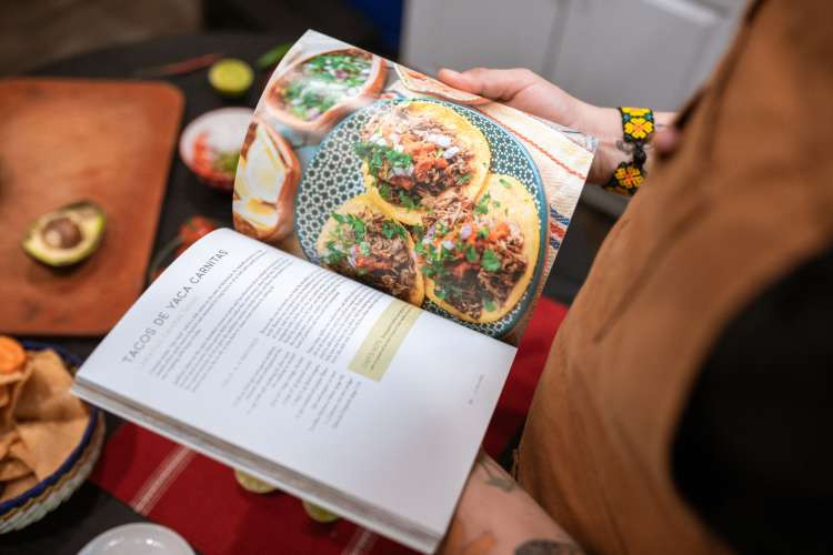 Healthy cookbooks, a nutritional wellness birthday gift idea for wife, inspiring healthy eating and culinary exploration (via Canva)