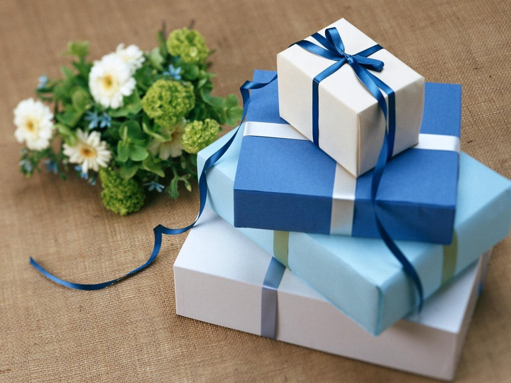 A hand holding a wedding gift box with a ribbon, symbolizing appropriate gift giving