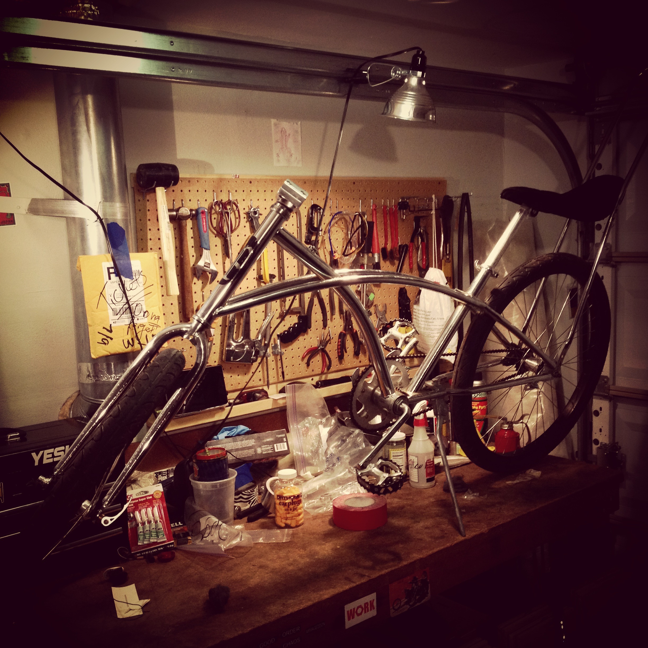 Man gifts that are experiences: Anselm's playa bike under construction, representing the gift of time and effort in creating something unique.