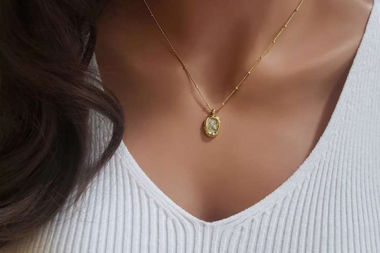 Personalized necklace with initials, a sentimental birthday gift idea for wife (via Etsy)