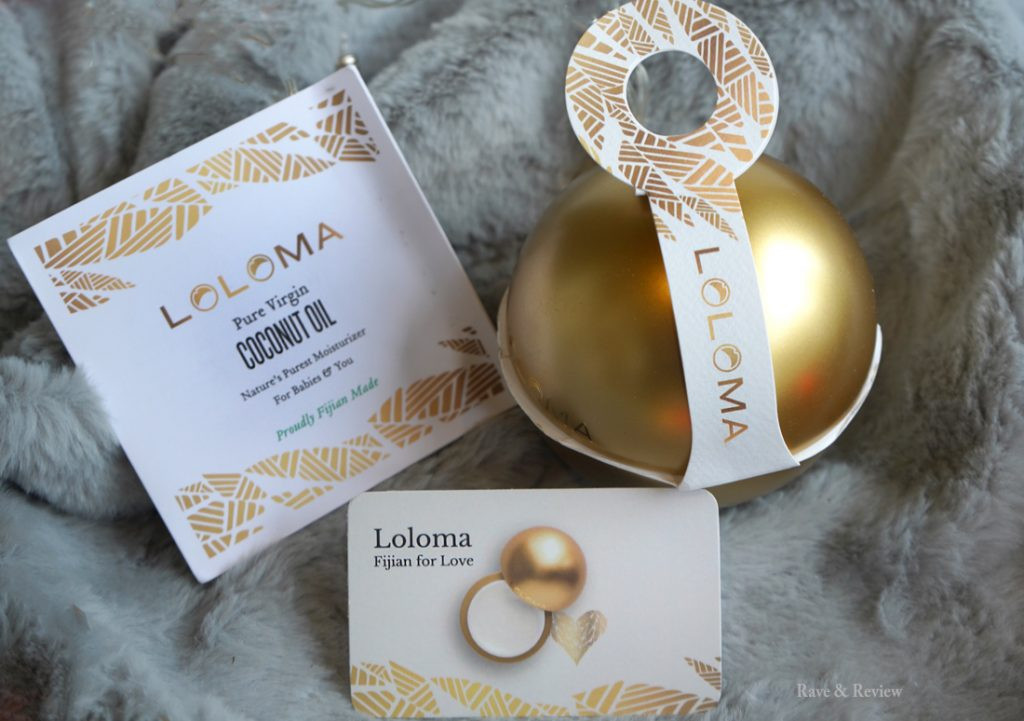 Loloma Coconut Oil bottle and coconuts