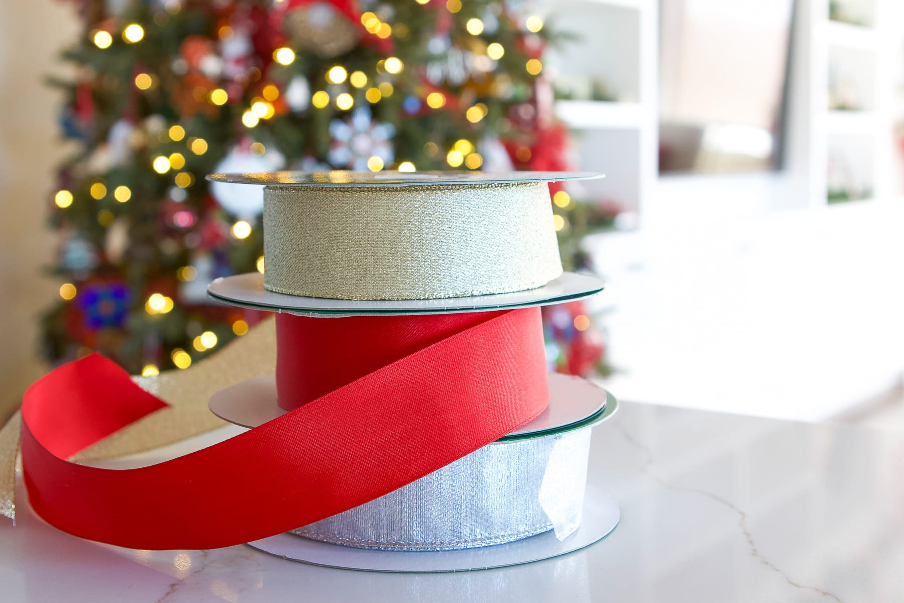 Large spools of wired ribbon from Costco, a budget-friendly option for bow-making