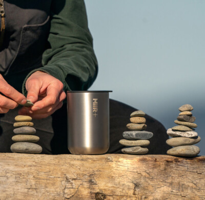MiiR 16 Oz. Climate+ Tumbler in Silver Satin shown in an outdoor lifestyle environment