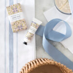 Outdoor candle holders repurposed as gift baskets for a DIY Mother's Day project.