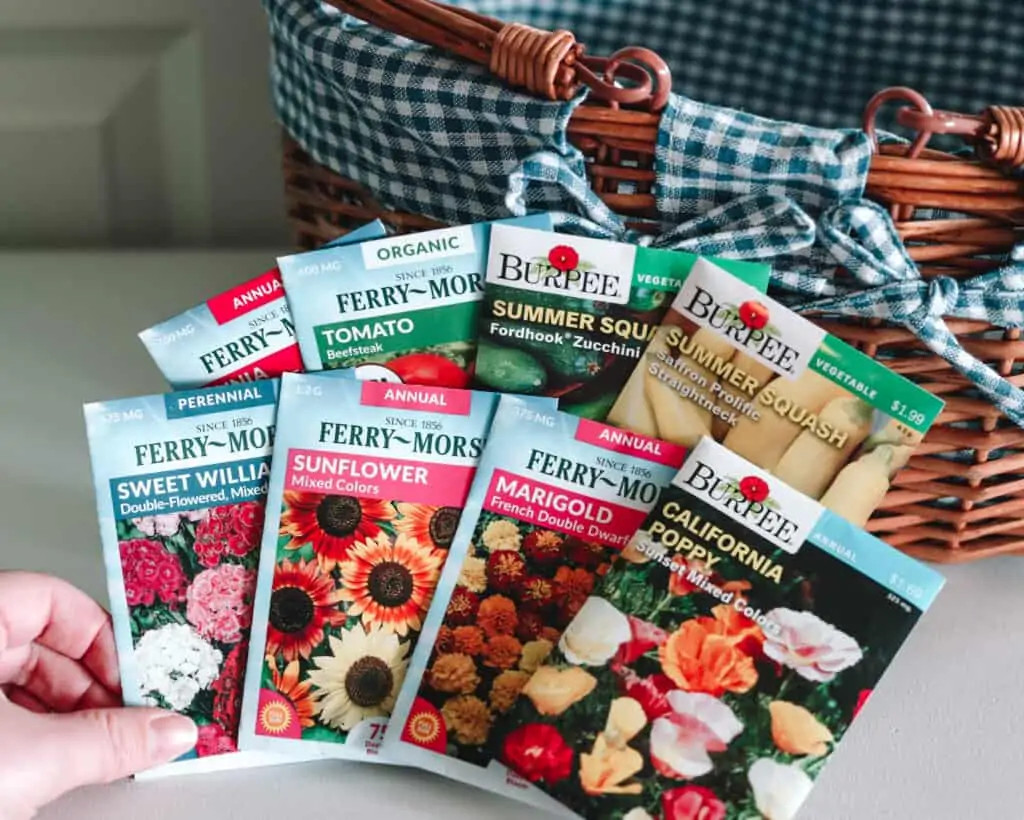 Image displaying various seed packets fanned out in a Mother's Day gift basket, emphasizing the theme of gardening and growth.