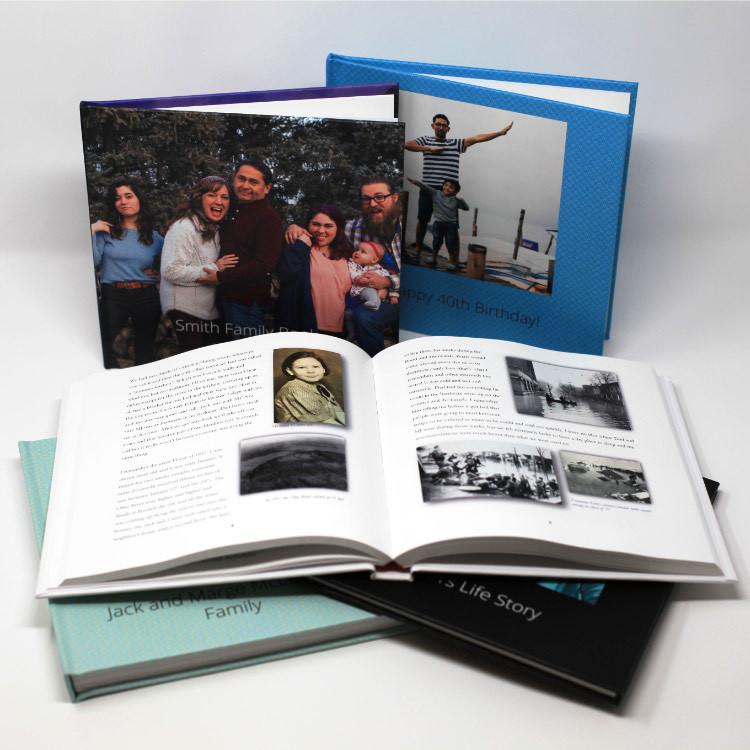 Memory books, some closed with photos on the cover and one open to a page with text and photos