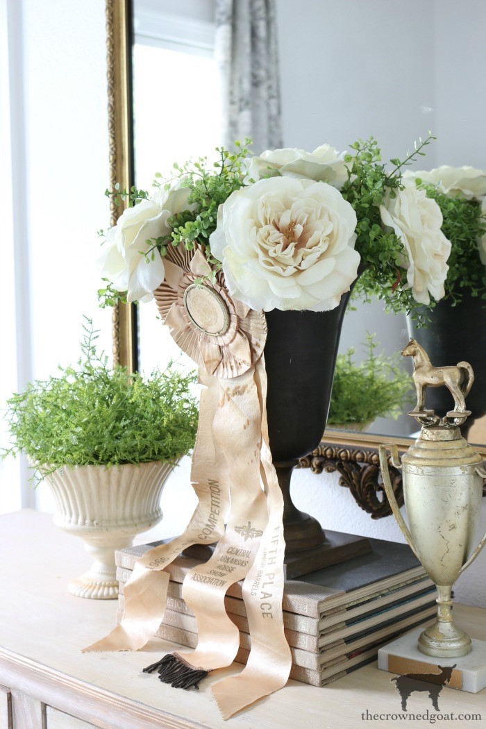 Vintage horse show trophies, arranged to emphasize their unique shapes and historical equestrian theme, making them distinctive decorative pieces.