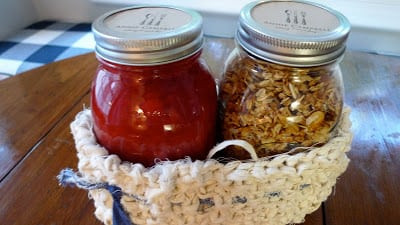 Homemade coconut granola and strawberry rhubarb compote in jars, a thoughtful hostess gift idea for breakfast.