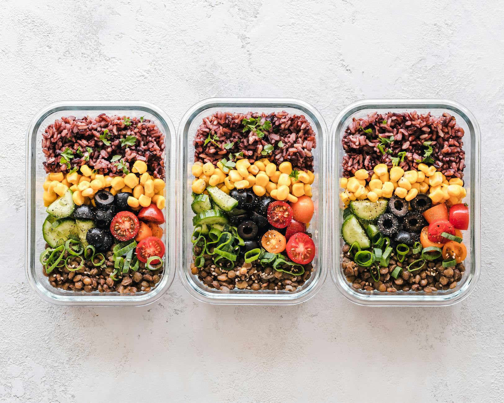 flat lay photography of three trays of food
