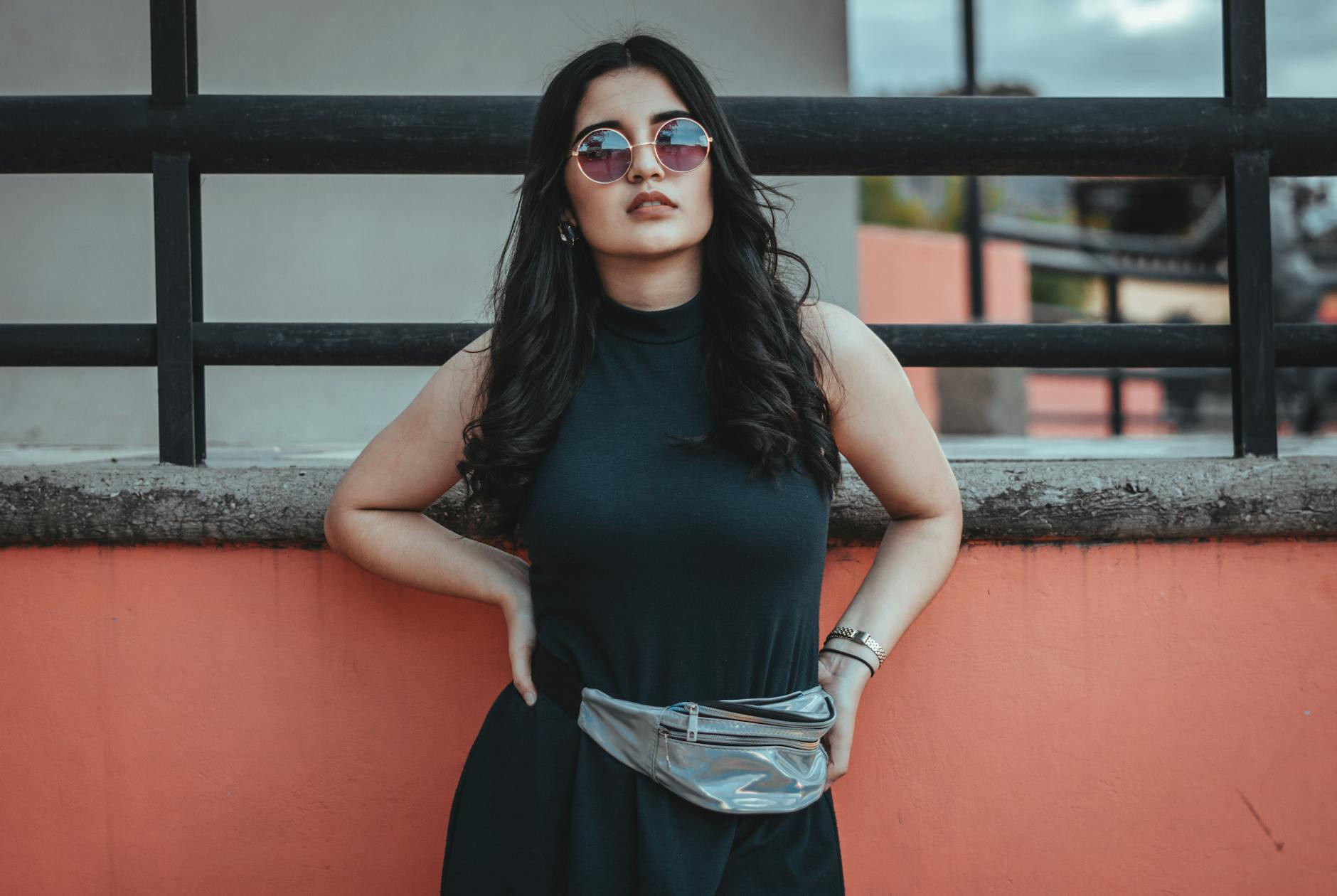woman wearing black dress and fanny pack