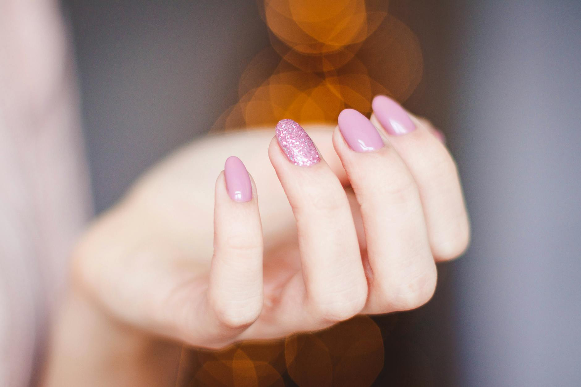 pink manicured hand