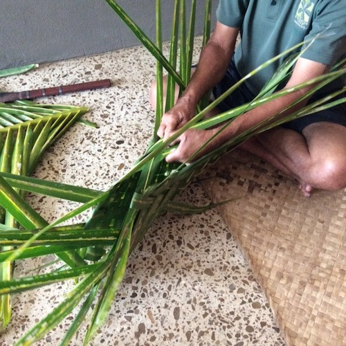 Detailed view of palm leaf weaving technique