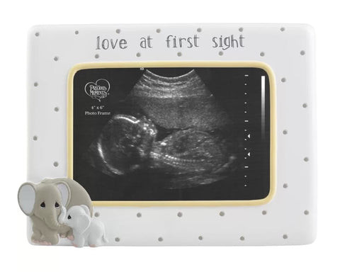 A framed baby ultrasound image, a classic pregnancy announcement gift