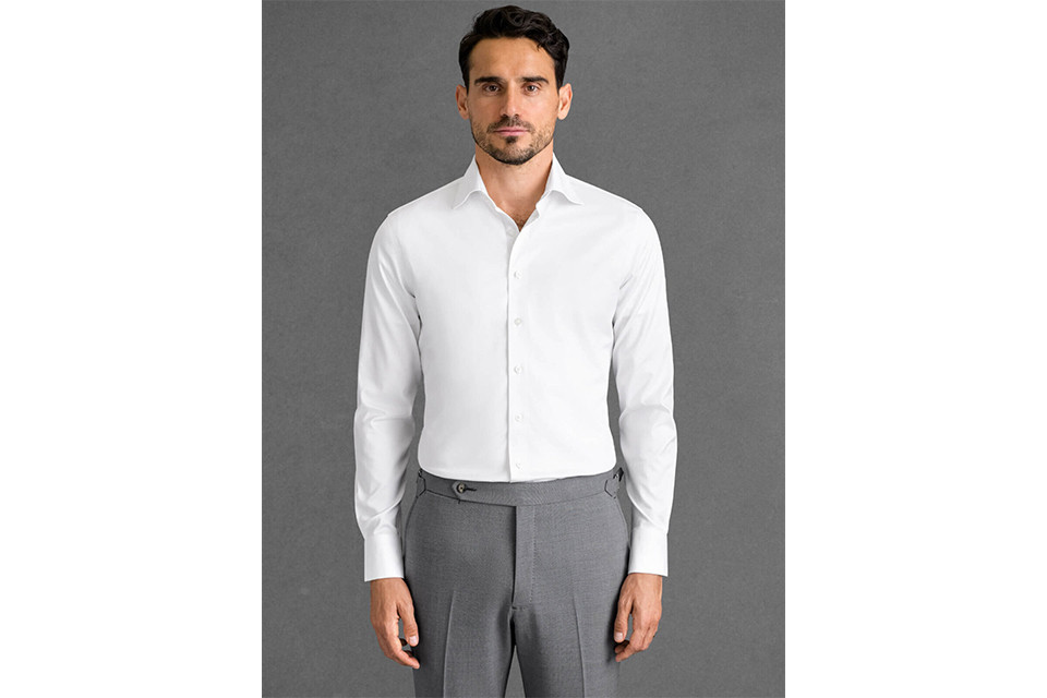 A man wearing a Proper Cloth non-iron stretch shirt, a practical luxury gift for men