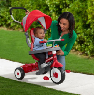 Radio Flyer 4-in-1 Stroll 'N Trike in red, showcasing versatile baby ride-on toys and outdoor baby gifts as long-lasting baby's first Christmas gifts.