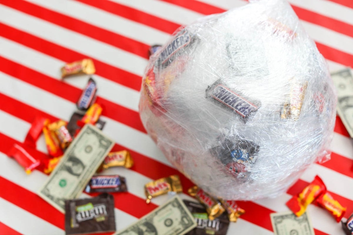 Saran Wrap Ball Game ready to be played, showcasing its tightly wrapped layers and promising hidden prizes.
