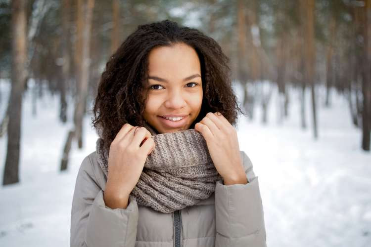 Quality scarf, a versatile fashion birthday gift idea for wife, adding warmth, style, and elegance to any outfit (via Canva)