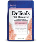 Fragrant bath salts in a clear jar with a scoop, suggesting a relaxing gift idea
