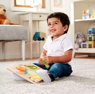 Melissa &amp; Doug Peek-a-Boo Touch and Feel Puzzle, a wooden puzzle with textured animal pieces and a mirror