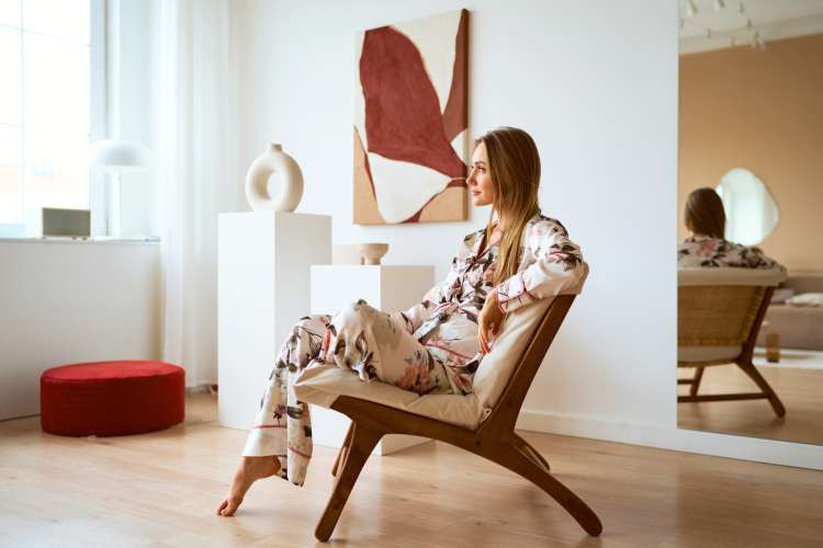 Silk pajama set, a comfortable luxury birthday gift idea for wife, offering elegance and relaxation for evenings at home (via Canva)