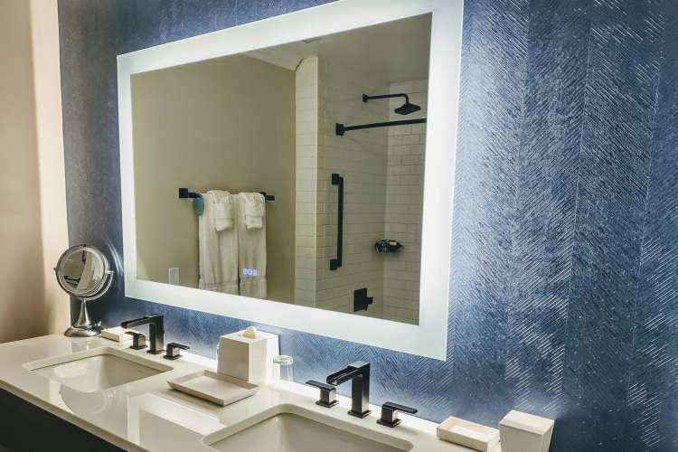 Smart mirror, a unique tech birthday gift idea for wife, blending technology and beauty for skincare and makeup routines (via Canva)