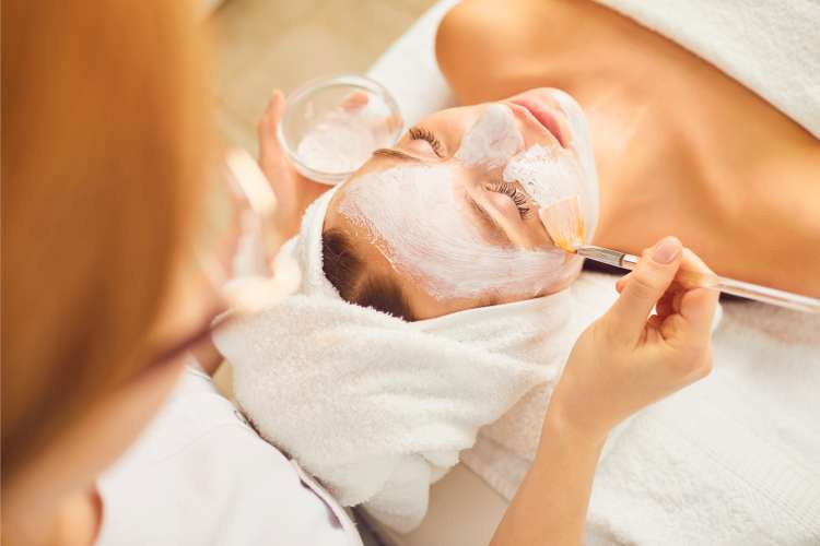 Spa day package, an indulgent birthday gift idea for wife, promoting relaxation and luxurious pampering (via Canva)