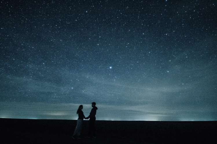 Starry night getaway, an unforgettable birthday gift idea for wife, offering romantic stargazing and escape (via Canva)