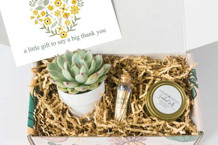 A succulent and candle gift box, a cute and unique bridesmaid proposal gift idea.