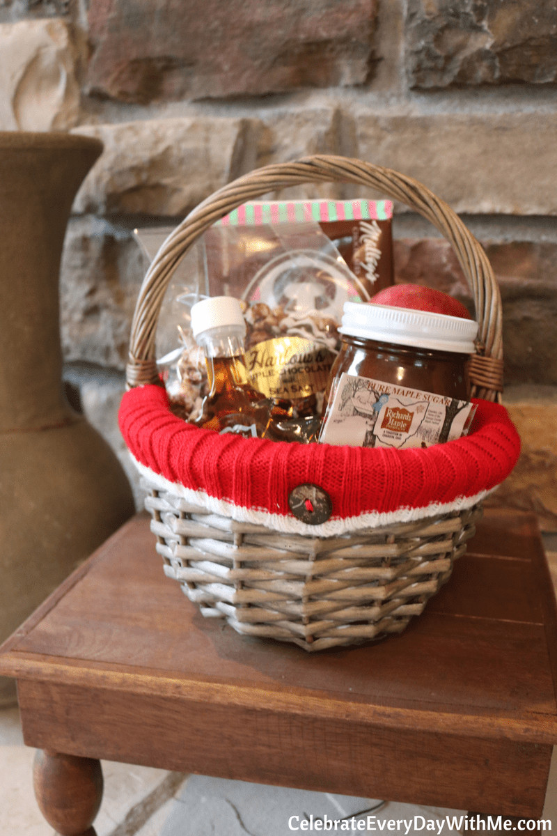 Local goods gift basket featuring regional specialties like maple syrup, chocolate, and apples