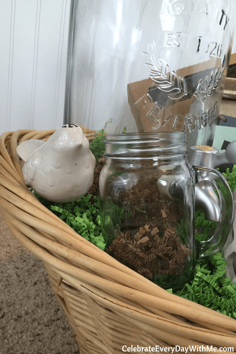 Close-up of a gift basket showcasing variety in item size and texture, including a small bird decoration