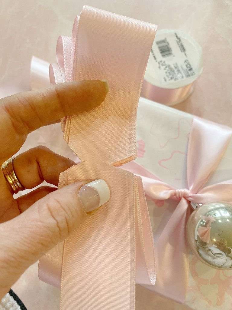 tips to making a bow, offering guidance on how to create beautiful bows for elegant gift packaging.