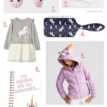 A collection of unicorn-themed gifts for girls, including slippers, thank you notes, a dress, hairbrush, hoodie, notebook, and headband, displayed on a white background.
